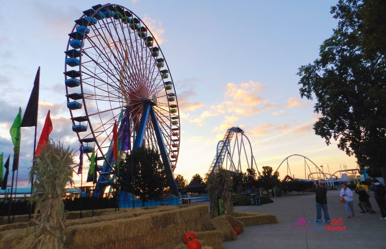 Cedar Point Sunrising over Ferris Wheel and Gatekeeper. Keep reading to know what to pack for an amusement park and have the best theme park packing list.