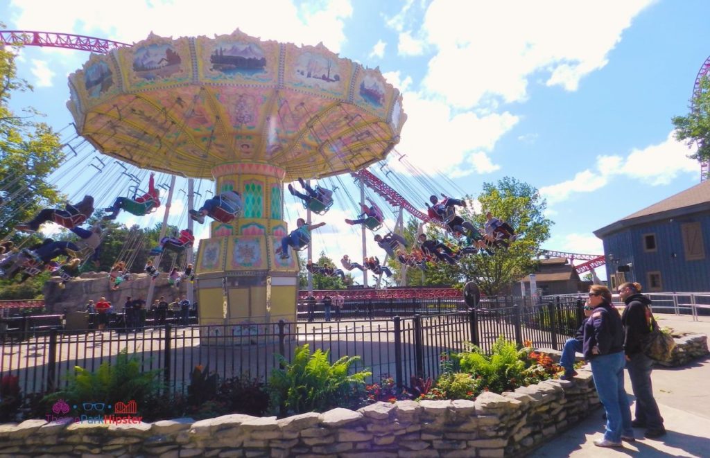 Cedar Point Swing ride in front of Maverick. Keep reading to learn about the Cedar Point Frontier Festival.