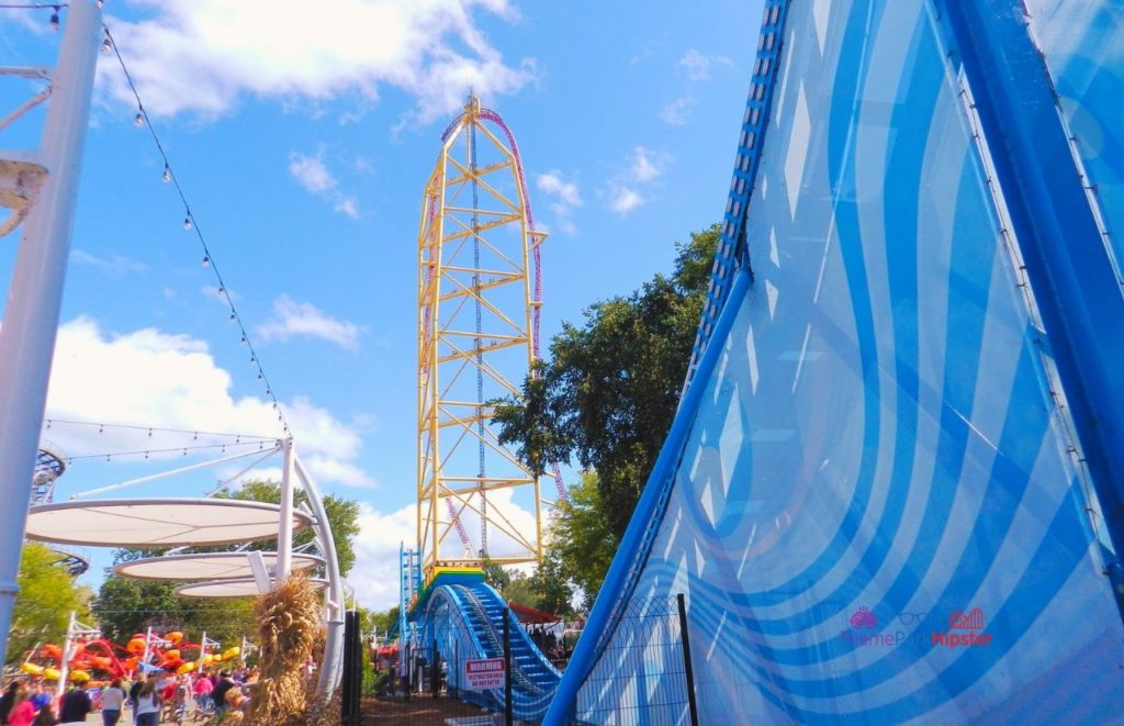 Cedar Point Top Thrill Dragster next to wave ride. Keep reading to get the best days to go to Cedar Point and how to use the Cedar Point Crowd Calendar.