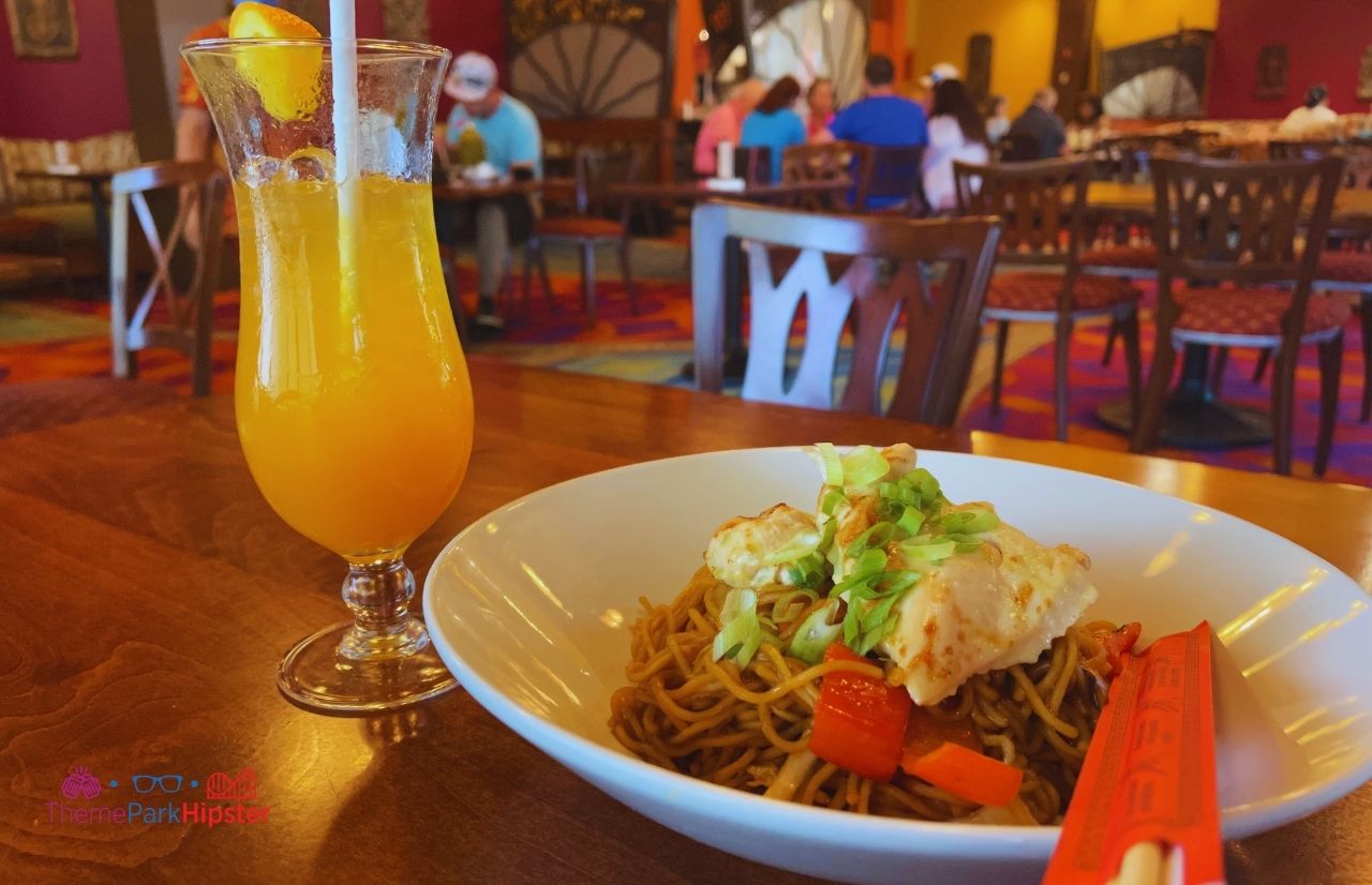 Disney Polynesian Resort Village Back Scratcher Cocktail with Chicken and Noodles. Keep reading see what's the best sushi in Disney World.