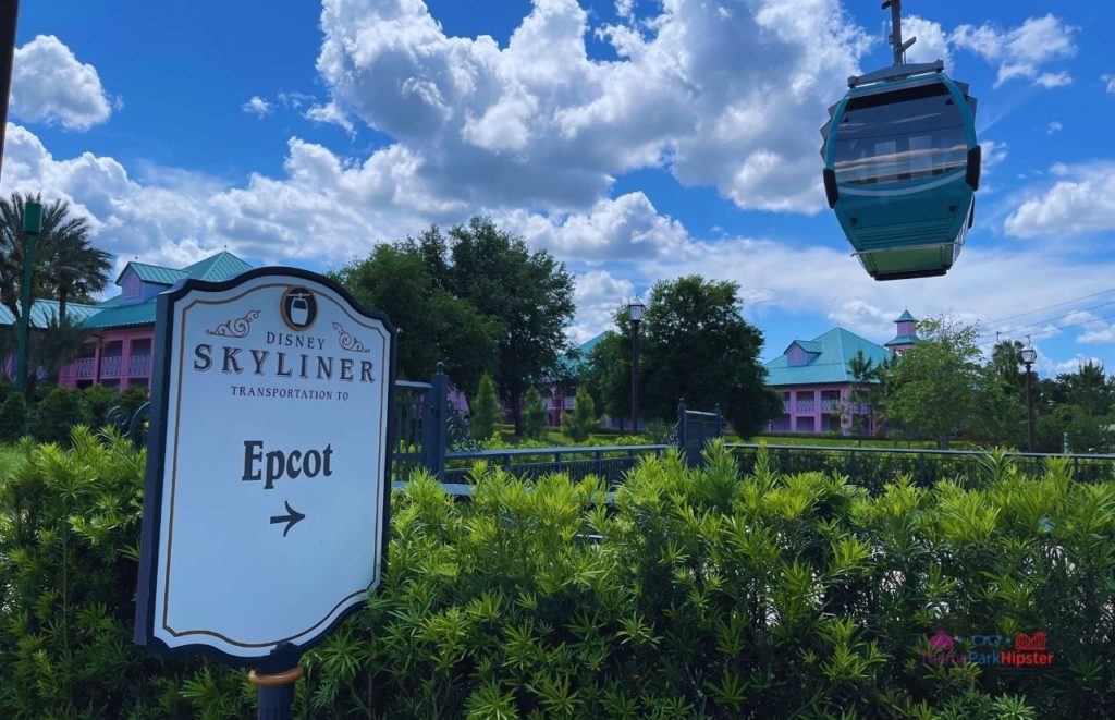 Disney Riviera Resort Epcot skyliner sign Caribbean Beach Club. Keep reading to learn more about your Disney Christmas trip and the Disney Christmas decorations.