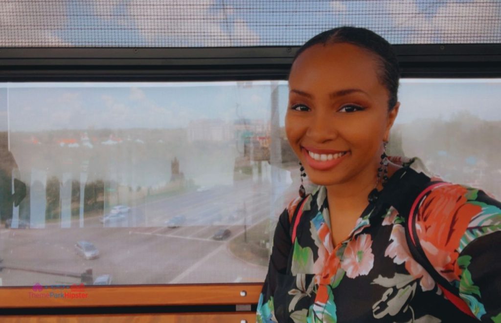NikkyJ up high on the Disney Riviera Resort Skyliner to Epcot. Keep reading to find out the most romantic things to do at Disney World.