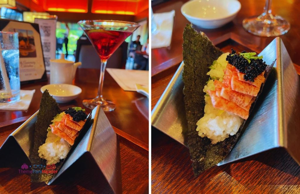 Shiki-Sai Restaurant in Epcot Japan Pavilion Wagyu Beef on top of rice top with caviar in Nori wrap and Violet Sake drink.