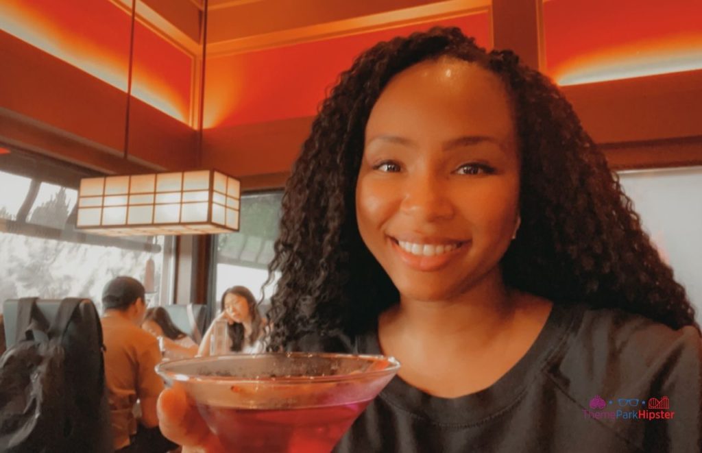 Dining Restaurant in Epcot Japan Pavilion With NikkyJ drinking Violet Martini. One of the best places to drink around the world Epcot.