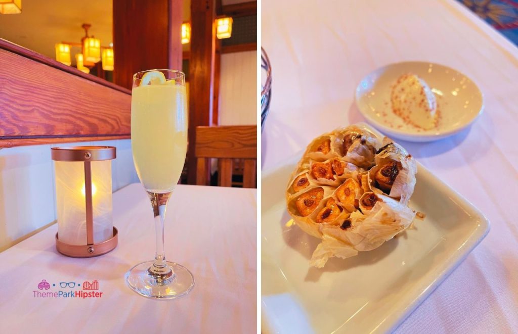 Yachtsman Steakhouse Yacht and Beach Club Resort at Walt Disney World with a French 75 cocktail and roaster garlic and salted butter on the table. Keep reading to find out the most romantic things to do at Disney World.