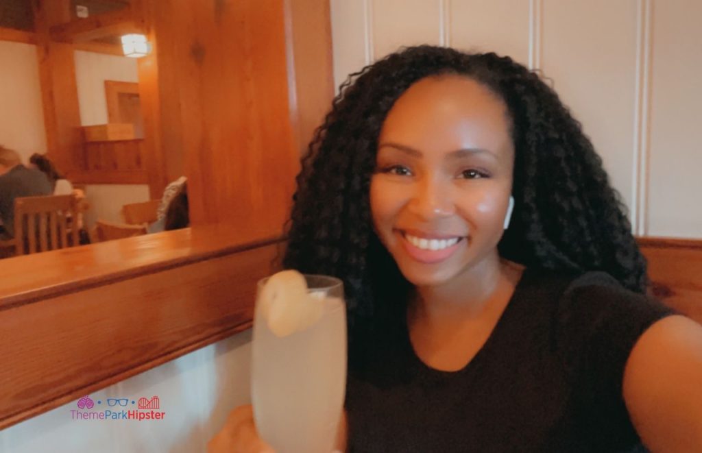 Walt DIsney World French 75 with NikkyJ. Keep reading to get the best things to do at Disney Springs for solo travelers on a solo disney world trip.