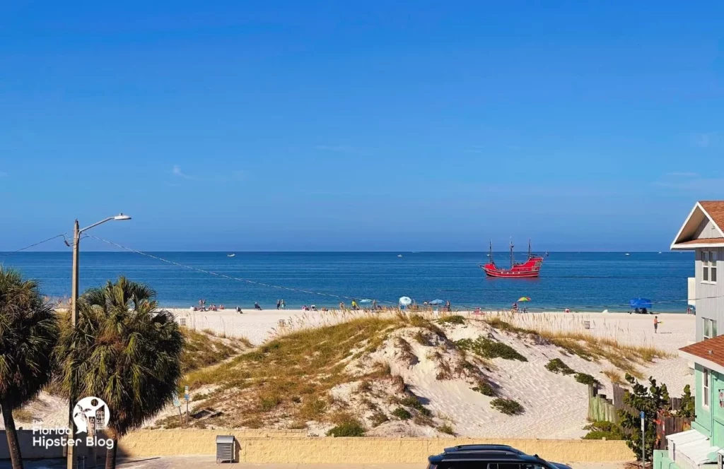 The Avalon Hotel in Clearwater. One of the best places to stay in Tampa. Gulf-of-Mexico-beach-View-from-the-balcony-with-Pirate-ship. One of the best day trips from Orlando for solo travelers.