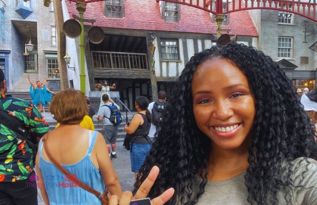 Universal Orlando Resort Harry Potter World with NikkyJ watching Celestina Warbeck at Diagon Alley at Universal Studios Harry Potter World. Keep reading to learn how to have the best Universal Orlando Solo Trip for Travelers going to theme parks alone.