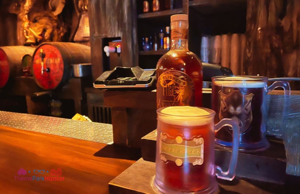 Universal Orlando Resort Hogshead butterbeer and fire whiskey at Harry Potter World in Islands of Adventure. Keep reading to get the full travel guide and review to the Three Broomsticks.