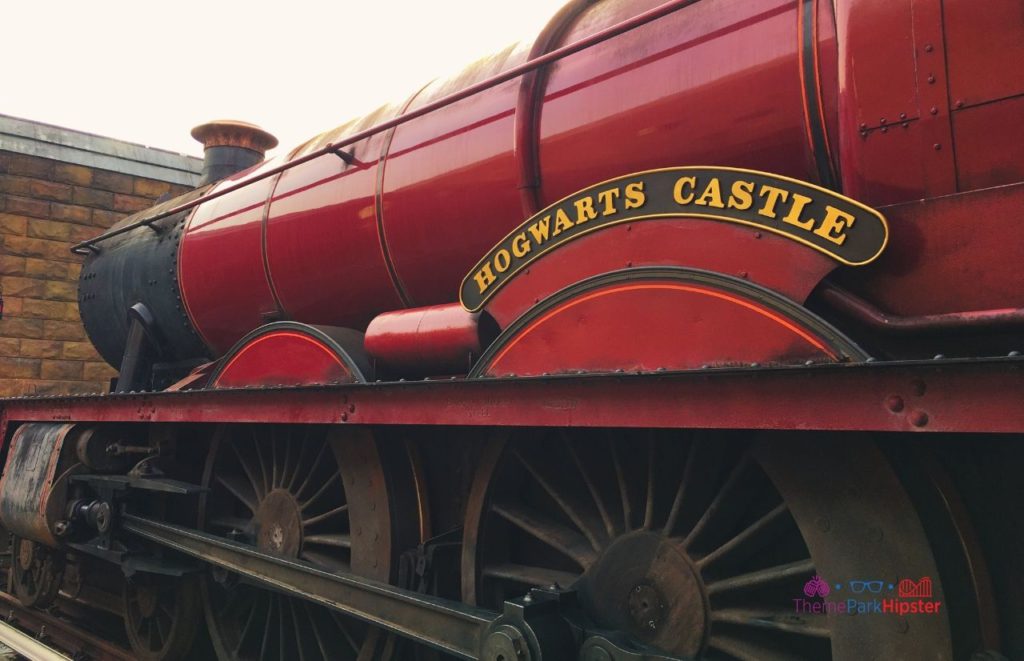 Universal Orlando Resort Hogwarts Express parked in Hogsmeade at Wizarding World of Harry Potter. One of the best Wizarding World of Harry Potter photo spots.