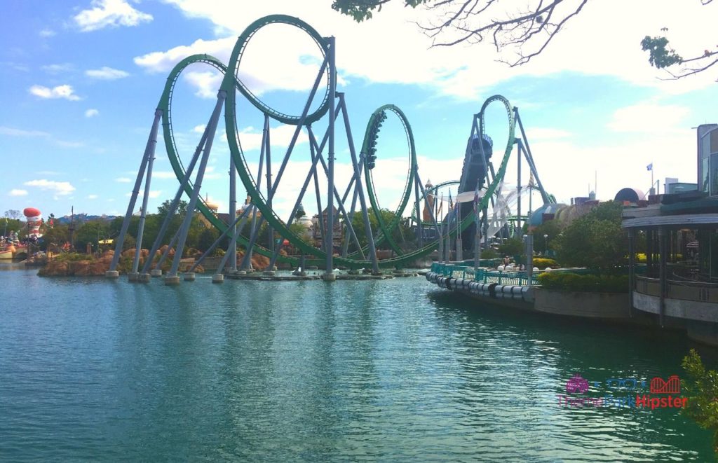 Universal Orlando Resort Incredible Hulk Roller Coaster riding over the Lagoon at Islands of Adventure. Keep reading to find out more about Hulk vs VelociCoaster at Universal Orlando.