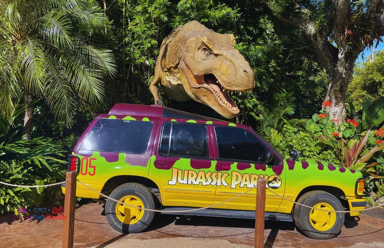 Universal Orlando Resort Jurassic Park in Islands of Adventure with T-Rex coming from trees over jeep