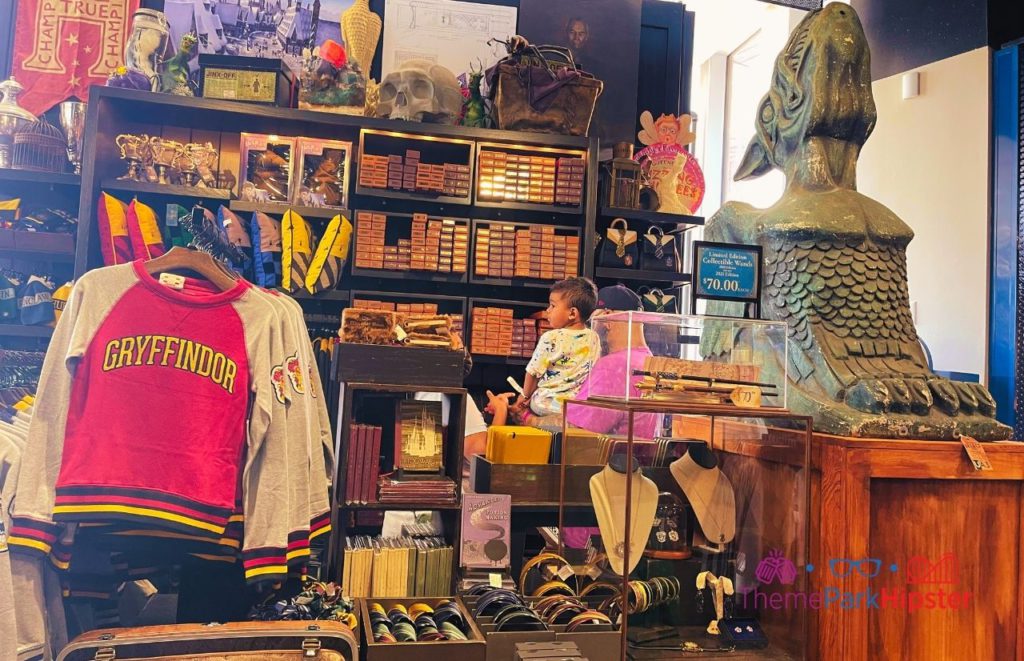 Universal Orlando Resort Legacy Store in Citywalk with Harry Potter Gifts and Merchandise Gryffindor Sweater. One of the best Harry Potter gifts for adults who are fans!