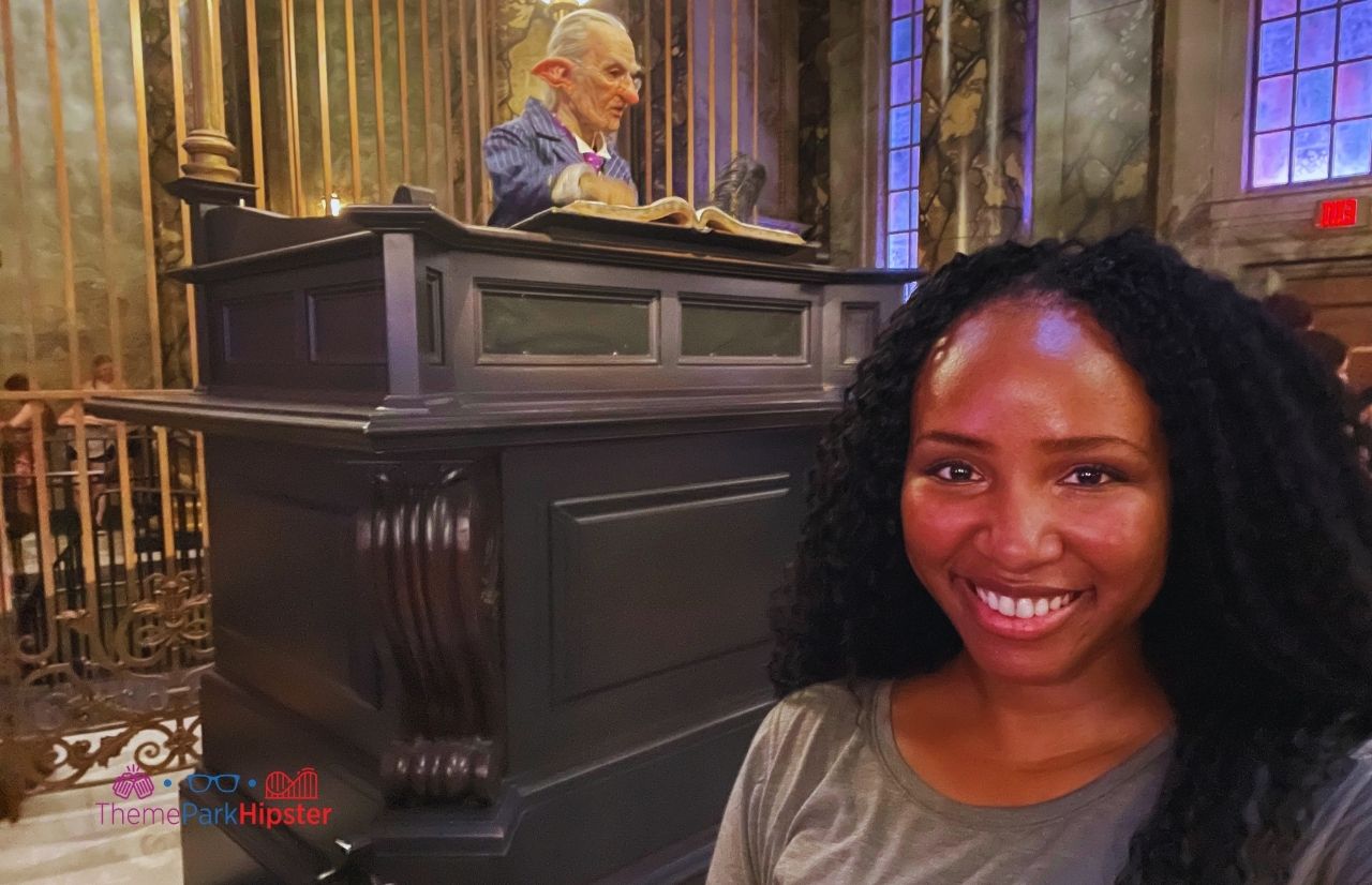 Universal Orlando Resort NikkyJ in front of Globin in Gringotts Bank in Diagon Alley at Universal Studios Florida Harry Potter World. Keep reading to learn how to have the best Universal Orlando Solo Trip for Travelers going to theme parks alone.