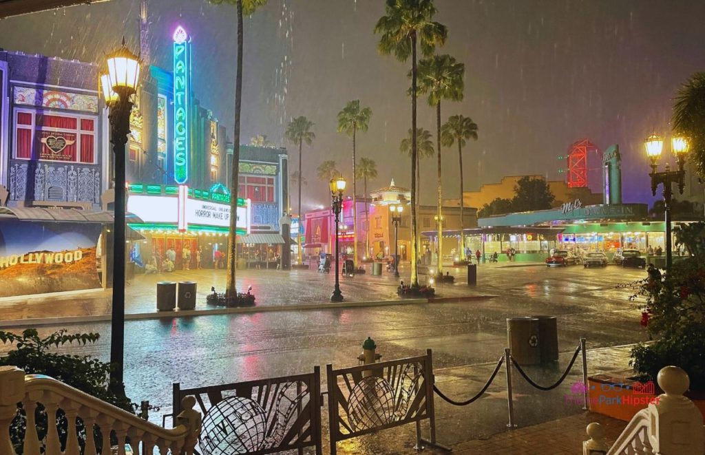 Universal Orlando Resort Rainy night in front of Horror Make Up Show and Mels Drive In at Universal Studios Florida. Keep reading to find out more about Universal Studios outfit ideas. 