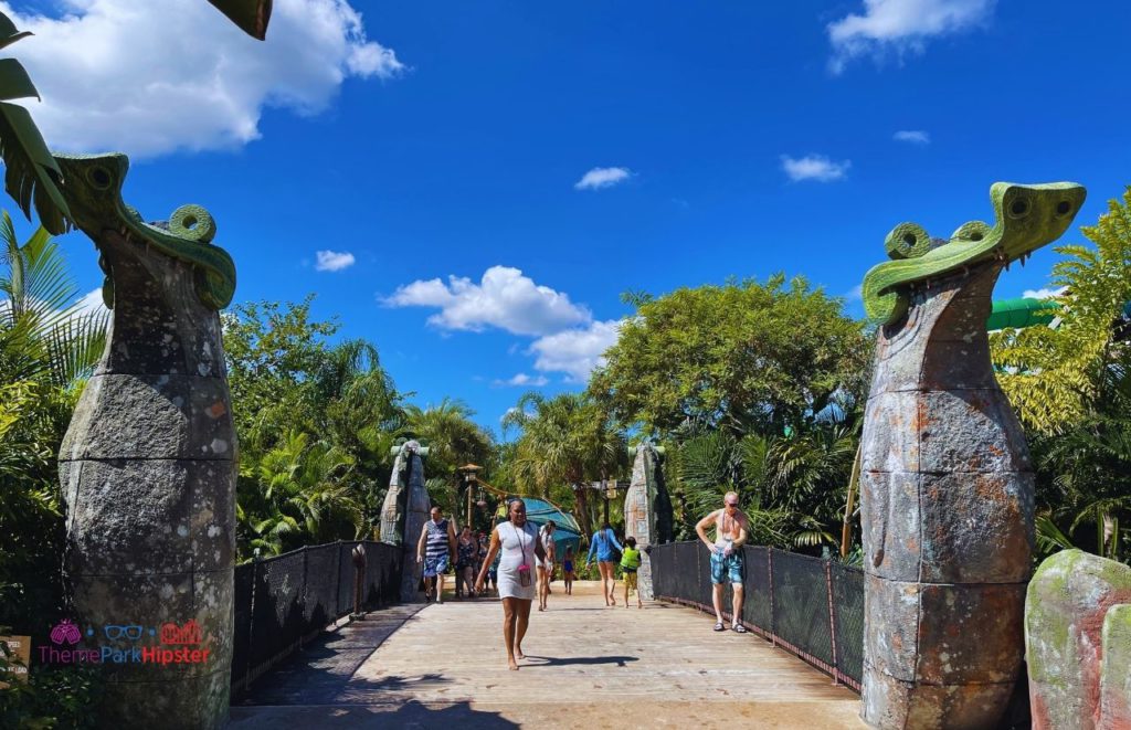 Universal Orlando Resort Volcano Bay with people walking across the bridge