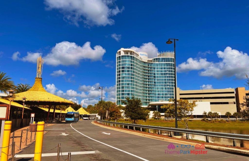 Universal Orlando Resort Volcano Bay Bus Stop with Aventura Hotel in the Background. Keep reading to learn about parking at Universal Studios Orlando.