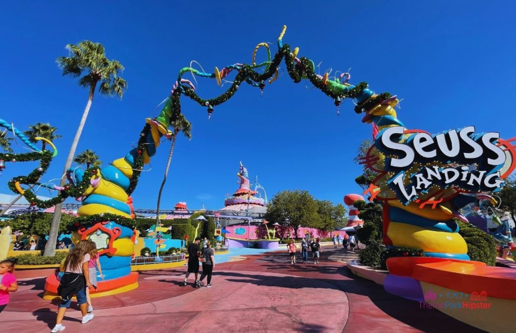 Universal Orlando Resort entrance to Christmas at Seuss Landing in Islands of Adventure. Keep reading to learn how to have the best Universal Orlando Solo Trip for Travelers going to theme parks alone.