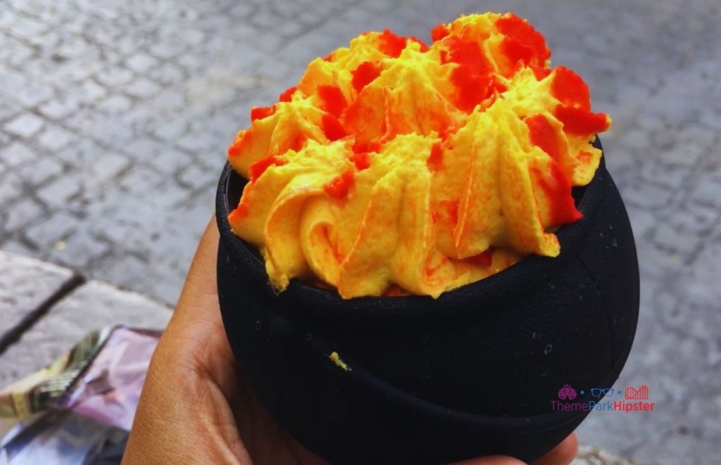 Universal Orlando Resort orange and yellow Cauldron Cakes at the Wizarding World of Harry Potter. Keep reading to get the best Harry Potter World souvenirs at Universal.