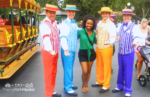 Disneyland Outfit ideas with NikkyJ in green top with black shorts and the dapper dans. Keep reading to learn what to wear to Disneyland in July.