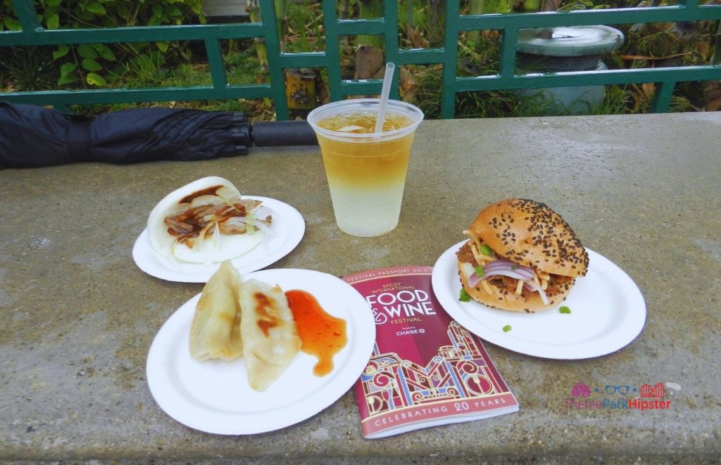 Epcot Food and Wine Festival China Booth Food Dumplings Beef Bao Buns and cocktails. Keep reading to know what to pack and what to wear to Disney World in September on your packing list.