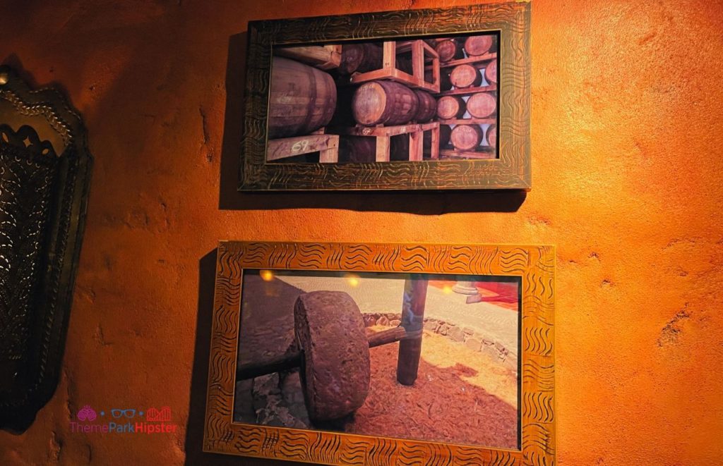 Epcot La Cava del Tequila Mexico Pavilion wall decor of artwork. Keep reading to find out more about tequila tasting Epcot.