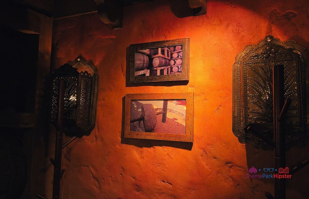 Epcot La Cava del Tequila Mexico Pavilion wall decor of artwork. Keep reading to find out more about tequila tasting Epcot.