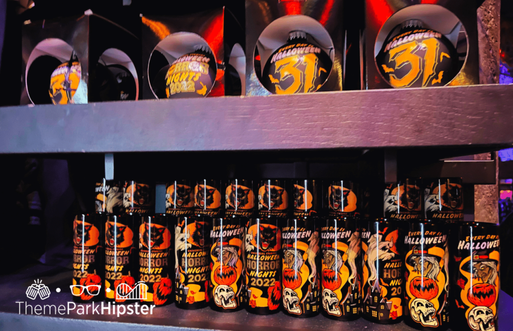 All Hallows Eve Boutique at Islands of Adventure HHN Merchandise Universal Studios HHN 31 Halloween Horror Nights 2022 shot glasses and cups. Keep reading about going to Halloween Horror Nights alone on a Universal Orlando Solo Trip and why the tagline Never Go Alone shouldn't scare you!