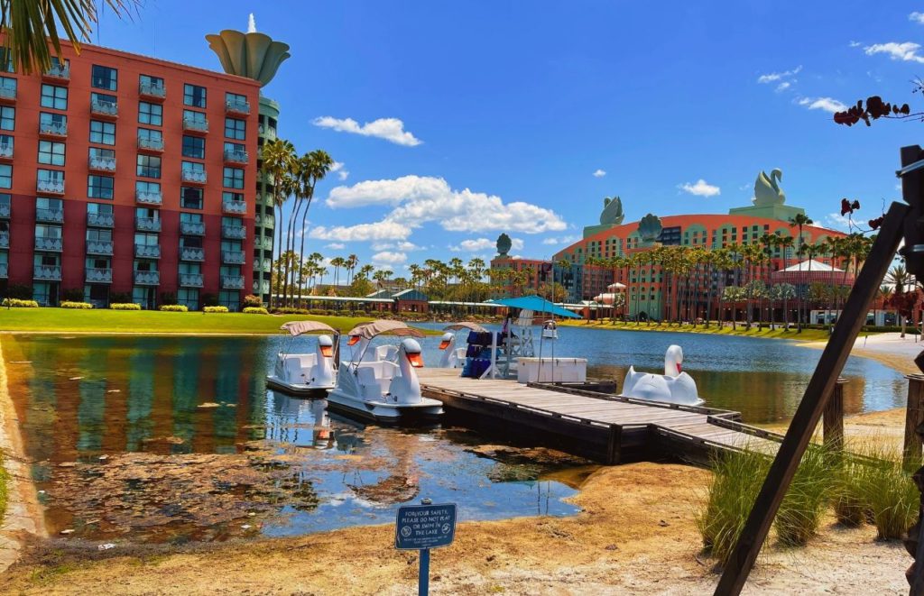 Swan and Dolphin Resort white boats on lagoon. Keep reading to know when is the Slowest Time at Disney World.