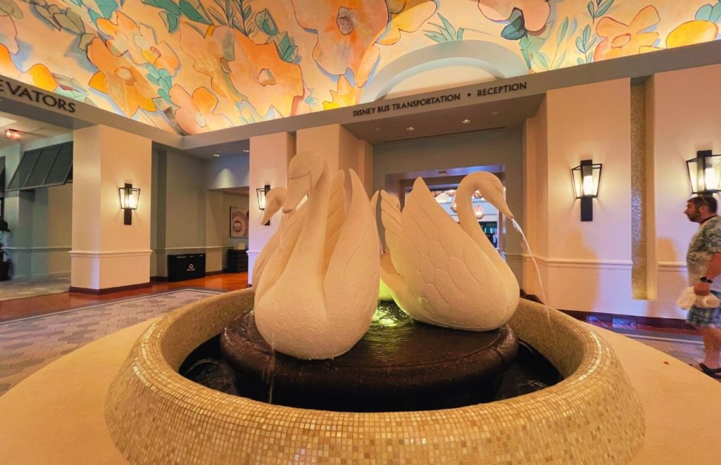 Swan statue at Disney Swan and Dolphin Resort. Keep reading for the full guide to Disney Resort parking fee for overnight guests. 