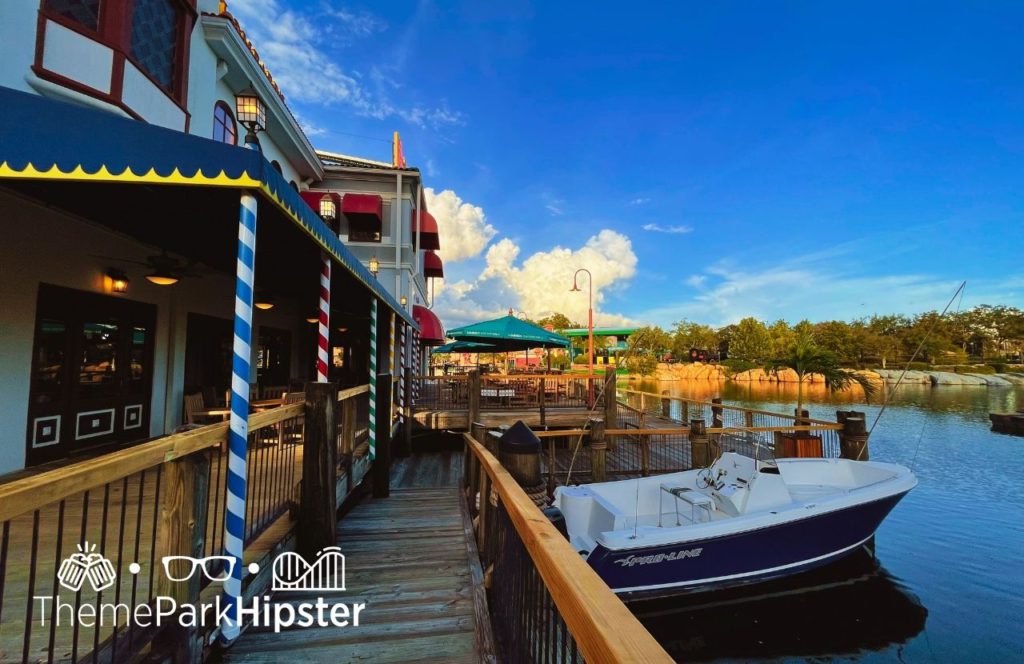 Universal Orlando Resort Lombard's Landing Seafood Restaurant at Universal Studios Florida outdoor seating area and view of lagoon. Keep reading to learn about the best Universal Orlando Resort restaurants for solo travelers.