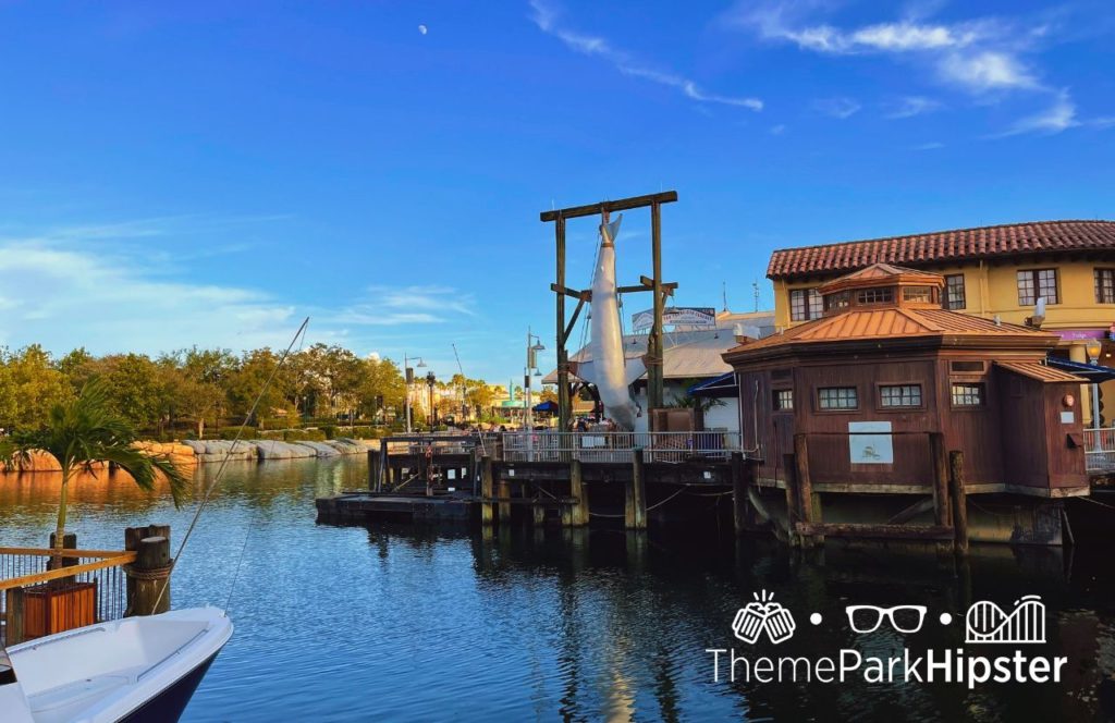 Universal Orlando Resort Lombard's Landing Seafood Restaurant at Universal Studios Florida view of bruce the shark in San Fransisco lagoon boat dock. Keep reading to get the best Universal Studios Orlando, Florida itinerary and must-do list!