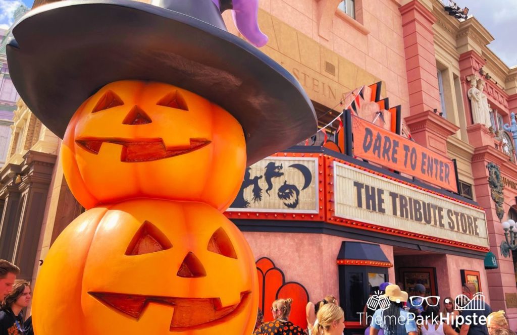 Mr Sweets Scare zone with large pumpkins outside the Tribute Store at HHN 31 Halloween Horror Nights at Universal Orlando. Keep reading discover more about Halloween Horror Nights hotels.