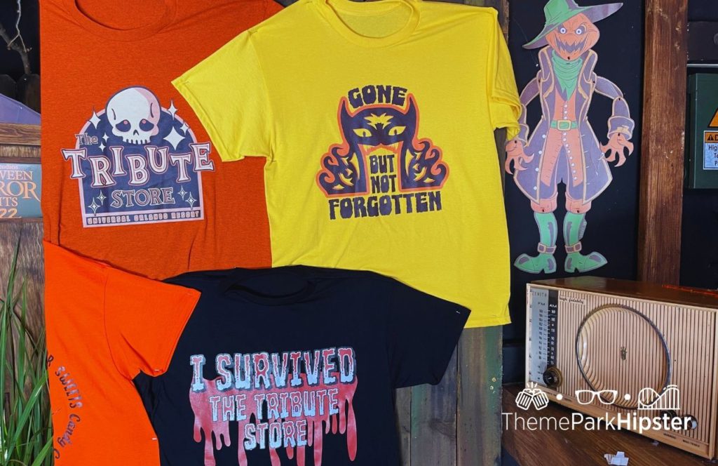 Orange, yellow and black shirts from the Tribute Store Merchandise HHN 31 Halloween Horror Nights 2022 at Universal Orlando. Keep reading to see what to wear to Halloween Horror Nights.