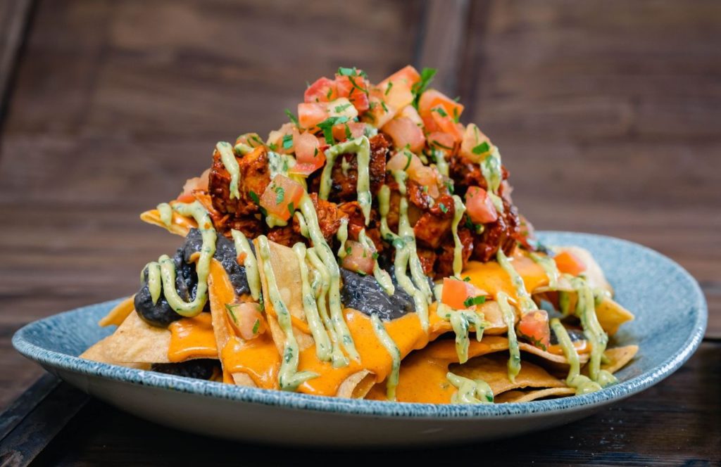 Ghost Pepper Nachos Lamplight Lounge Boardwalk Dining Halloween at Disneyland and Disney California Adventure Oogie Boogie Bash Party. One of the best places to eat in Disneyland Resort.