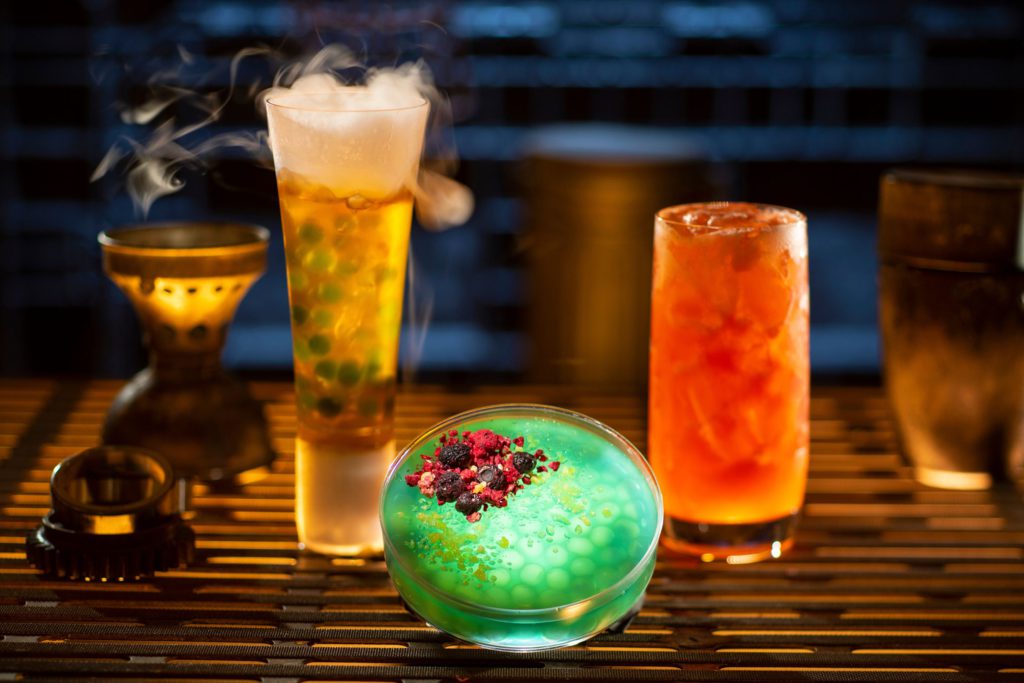 Left to right, non-alcoholic drinks: Carbon Freeze, Oga’s Obsession provision and Cliff Dweller can be found at Oga’s Cantina at Star Wars Land in Disneyland and Hollywood Studios. Keep reading to find out what best drinks at Oga's Cantina are in Disney World Hollywood Studios and Disneyland.