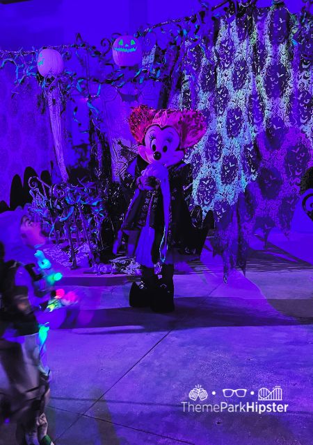 Minnie Mouse as a Sanderson Sister from Hocus Pocus Disney California Adventure and Disneyland Halloween Event at Oogie Boogie Bash Food, Tips, Dates and more Disney Halloween Guide.