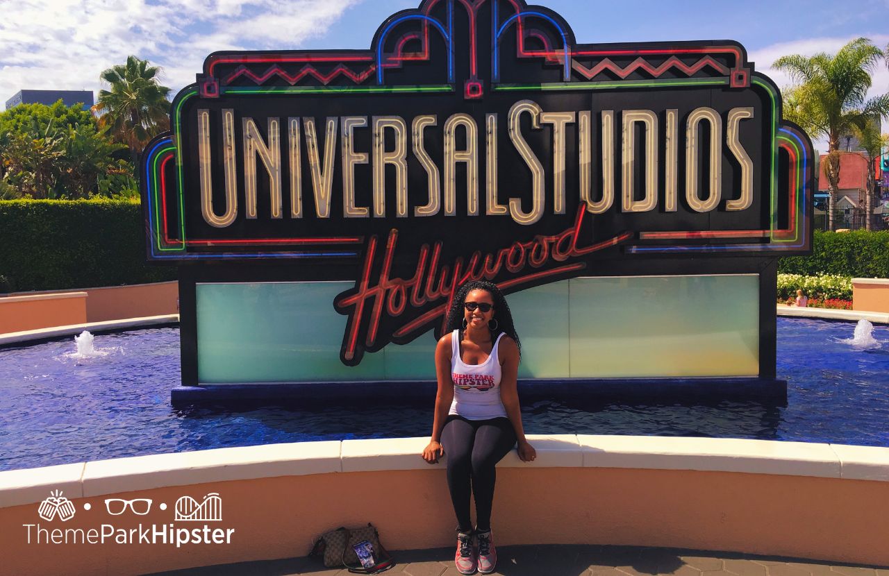 Solo Traveler NikkyJ in front of classic Universal Studios Hollywood sign