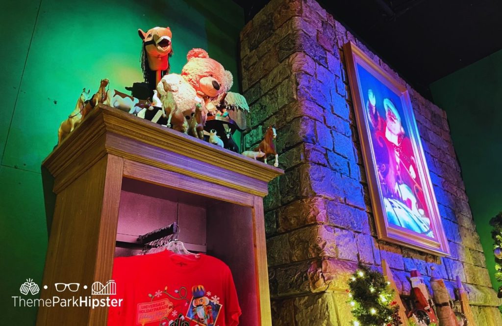 Tribute Store Fireplace area with Santa Christmas at Universal Studios in Universal Orlando Resort Keep reading to get more information on Thanksgiving at Universal Studios.