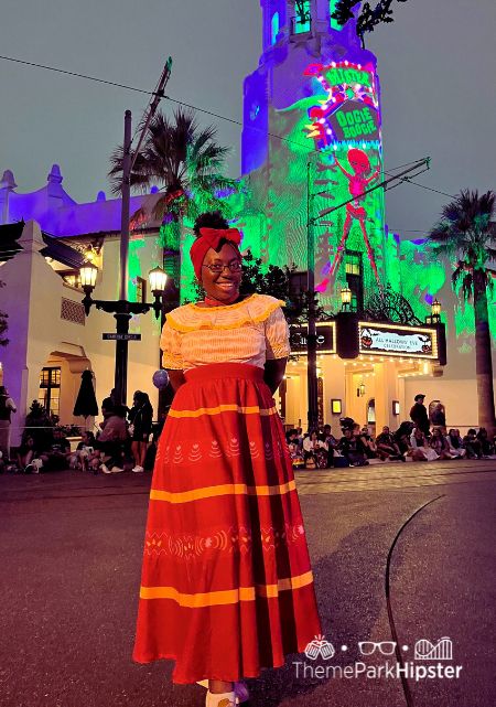 Victoria Wade as Dolores Madrigal from Encanto Disney California Adventure and Disneyland Halloween Event at Oogie Boogie Bash Food, Tips, Dates and more Disney Halloween Guide.