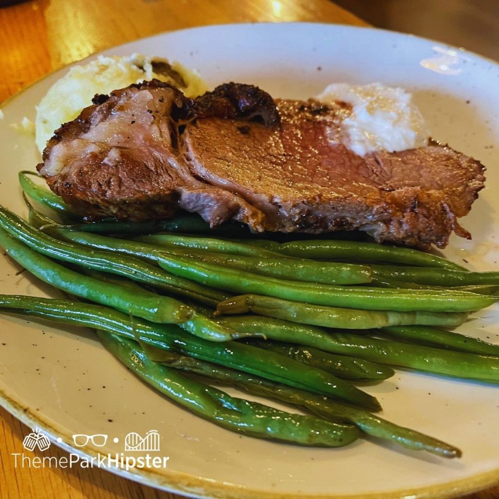 Boatwrights Dining Hall at Disney Port Orleans Resort Steak with Mashed Potatoes and Green Beans. Keep reading to learn how to do Thanksgiving Day Dinner at Disney World.