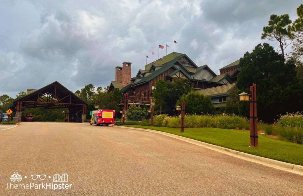 Disney Wilderness Lodge at Christmas front entrance with bus. One of the best things to Do at Disney World for Christmas