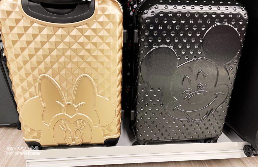 Gray Mickey Mouse and Gold Minnie Mouse Suitcase with Epcot inspired pattern. One of the best Disney World Luggages to pack