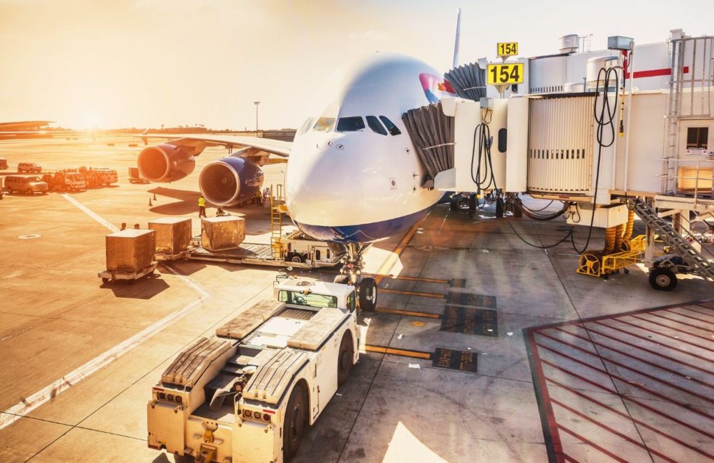 Airplane loading at John Wayne Airport. Keep reading to learn what the best airport for Disney is. LAX or John Wayne