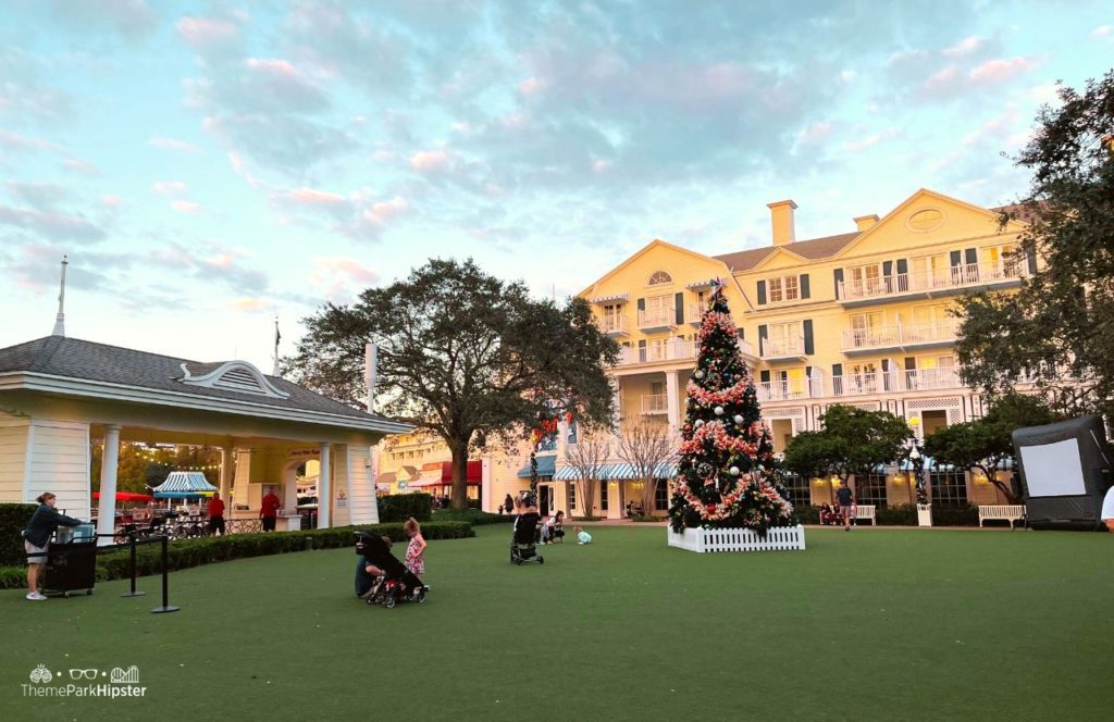 Christmas at Disney Boardwalk Inn and Villas Christmas Tree on Green Lawn. Keep reading to know when is the Slowest Time at Disney World.