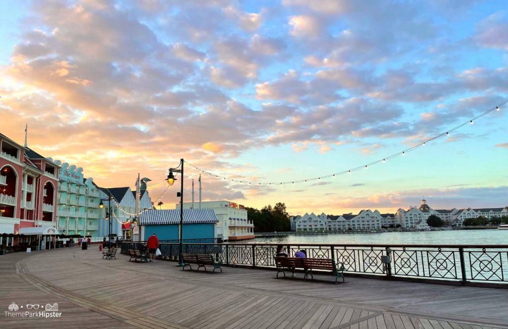 Christmas at Disney Boardwalk Inn and Villas over Crescent Lake at sunset. Keep reading to know how to choose the best Disney Deluxe Resorts for your vacation.