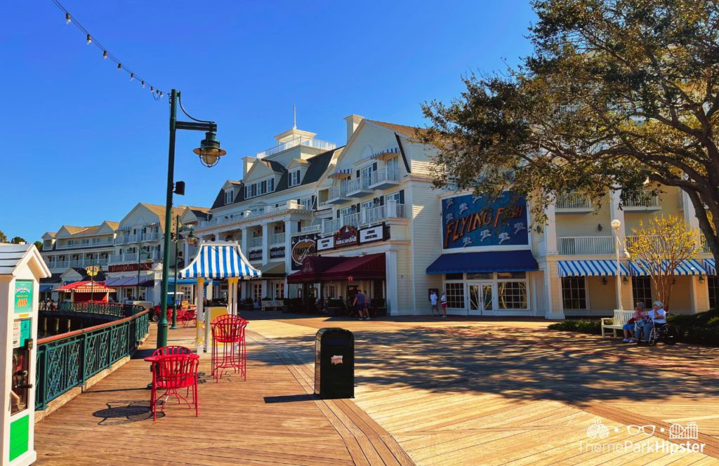 Coney Island type boardwalk with Flying Fish next to AbracadaBar at Disney BoardWalk. Keep reading to learn the most romantic things to do at Disney World.