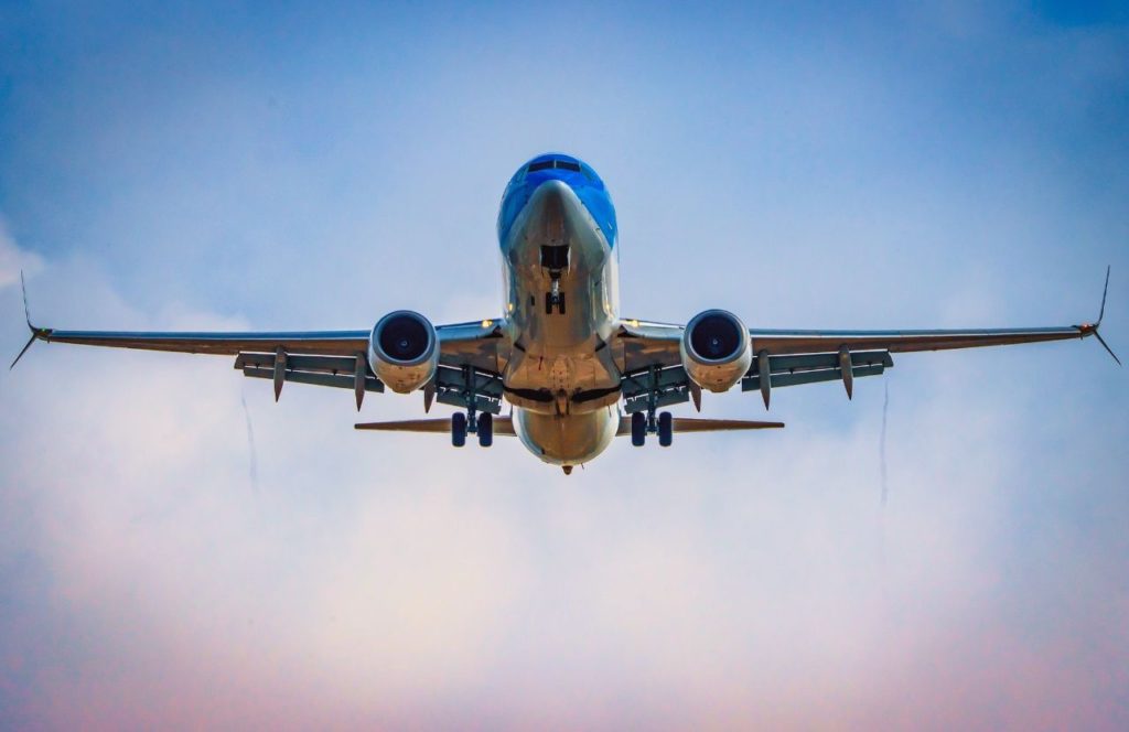 Plane landing at John Wayne Airport for Disney. Keep reading to learn how to prevent jet lag at Disney World in Orlando, Florida.