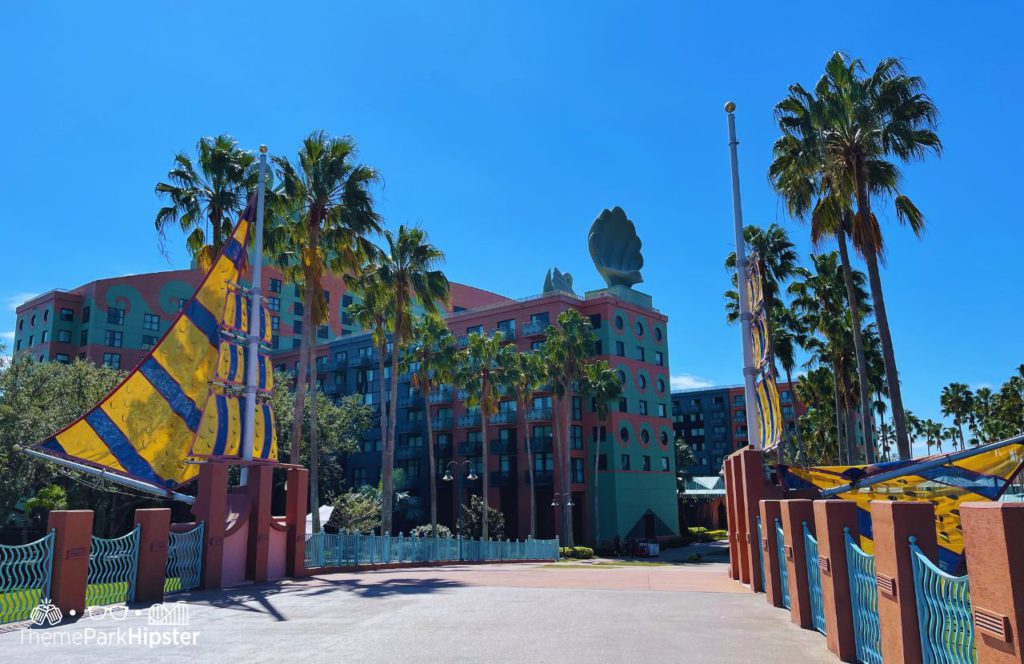 Walking over the bridge to Swan and Dolphin Hotel at Walt Disney World. Keep reading to discover more about Swan and Dolphin Resort Hotel at Disney. 