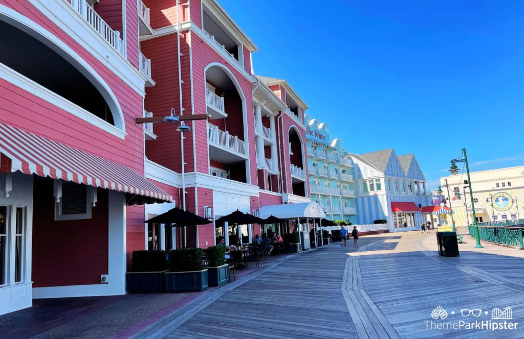 Walking to Big River Grille and Brewing Works at Disney BoardWalk Inn. Keep reading to know how to choose the best Disney Deluxe Resorts for your vacation.
